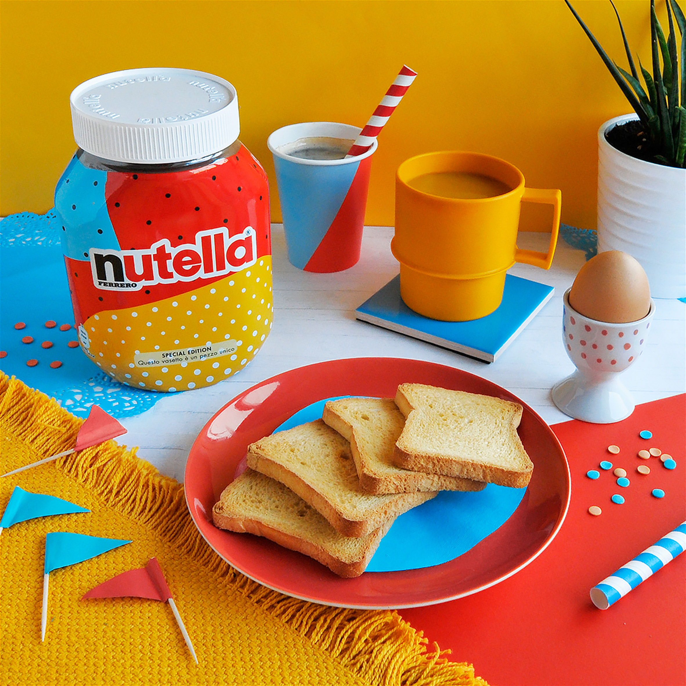 Nutella jar with AI-designed packaging in a colourful breakfast setting with toast, coffee, and decorations.